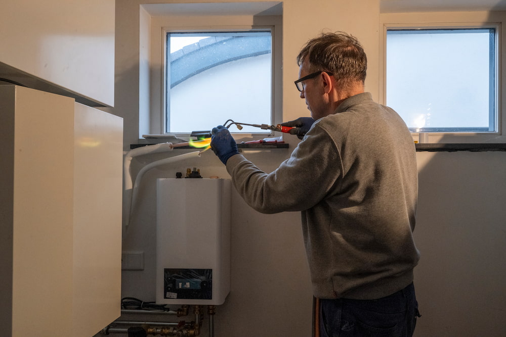 Engineer doing boiler repair work
